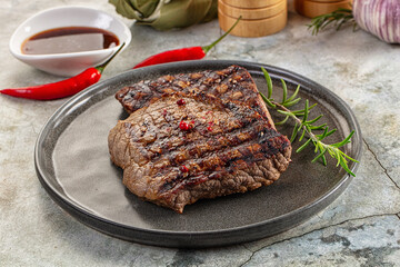 Grilled juicy beef steak with pepper