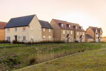 New houses in a housing development in England at sunset in spring