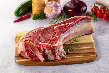 Raw prime beef steak with bone