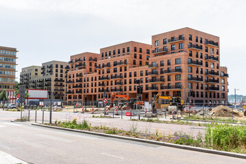 Apartment buildings under construction in a new development in a urban setting on a sunny summer day