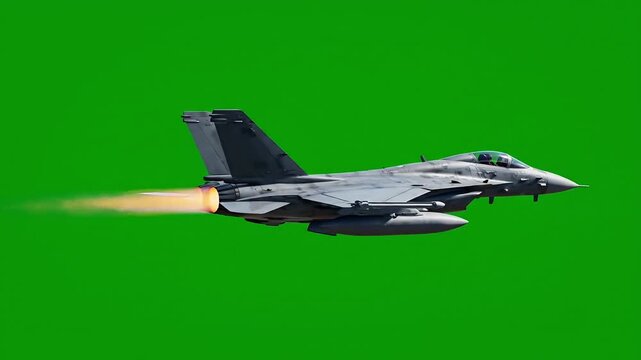 Military jet flying through clear green skies with pilot on board