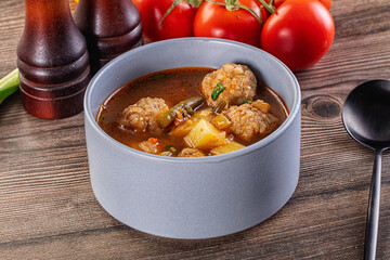 Tomato Soup with meatballs and vegetables