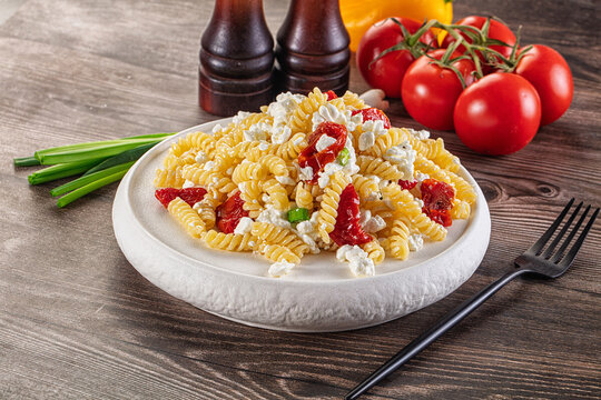 Italian pasta fusili with curd