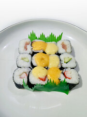 Delicious Small Sushi Pieces Served On White Plate