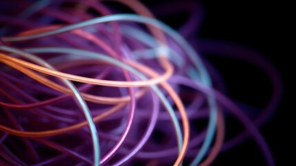 Abstract tangle of vibrant glowing fiber optic cables against a dark background