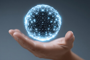 Human hand holding glowing blue digital sphere. This futuristic network symbolizes global communication, connection, and data technology, expressing sense of wonder and innovation
