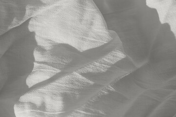 Abstract background made of natural crumpled fabric texture with sunlit and shadow. Color of the 2026 year inspired