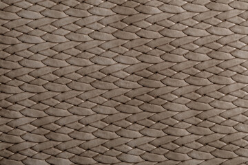 Woven textile texture showing a complex pattern in neutral colors suitable for crafting and design projects