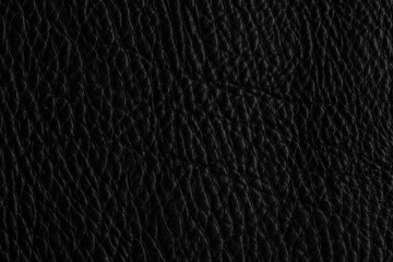 Close up view of black leather surface showing texture and design details in natural light during daytime