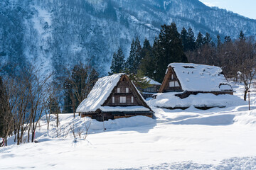 The serene and historic gassho-zukuri village of Ainokura, a UNESCO World Heritage site in Gokayama region, blanketed in winter snow. Toyama, Japan.