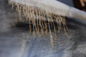 Abstract painting on canvas close-up. Paint drips.