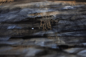 Abstract painting on canvas close-up. Paint drips.