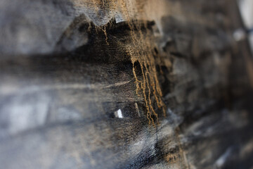 Abstract painting on canvas close-up. Paint drips.