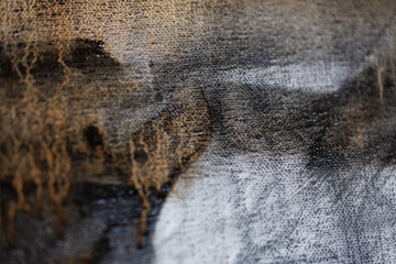 Abstract painting on canvas close-up. Paint drips.