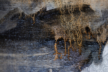 Abstract painting on canvas close-up. Paint drips.