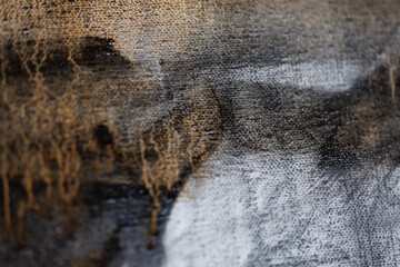 Abstract painting on canvas close-up. Paint drips.