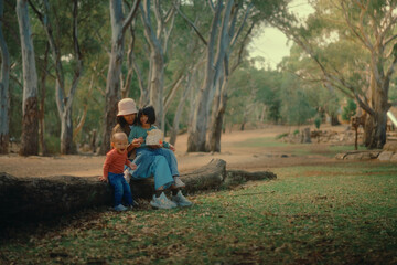 A calm and serene moment of family interaction takes place in a beautiful and peaceful natural setting