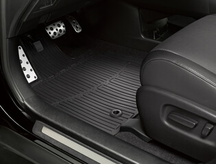Luxury car floor mats in black plastic