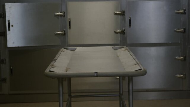 A corpse on a gurney in a hospital morgue