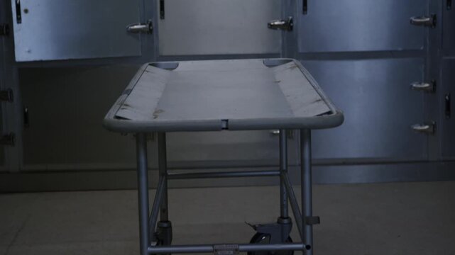 A corpse on a gurney in a hospital morgue
