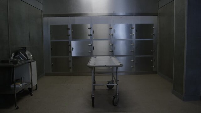 A corpse on a gurney in a hospital morgue