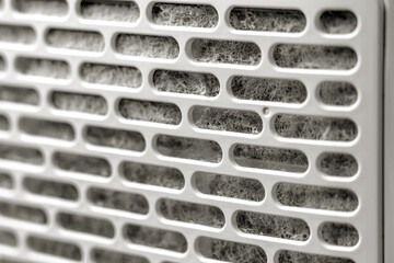 Home air purifier with dust contaminated filter cartridge close up