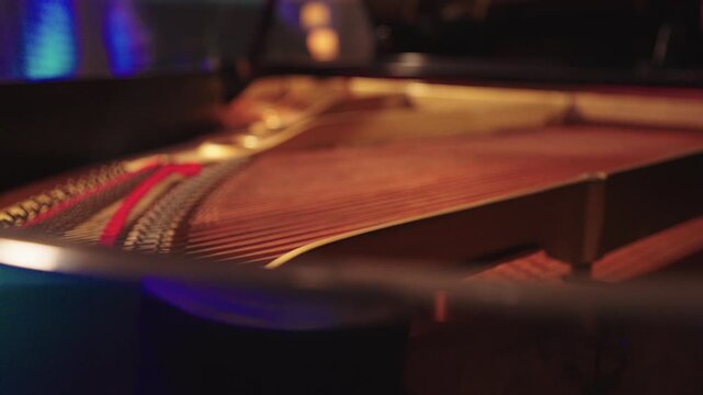 Close-up of grand piano strings with smooth camera movement