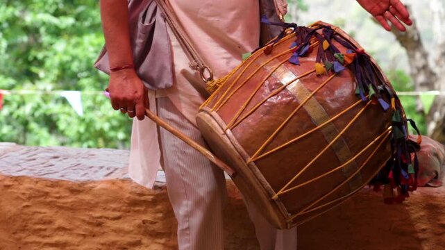 Traditional drum performance during a poor village marriage in Uttarakhand, India. Rural wedding music highlights cultural rituals, community bonding, simple lifestyle, and authentic mountain village 