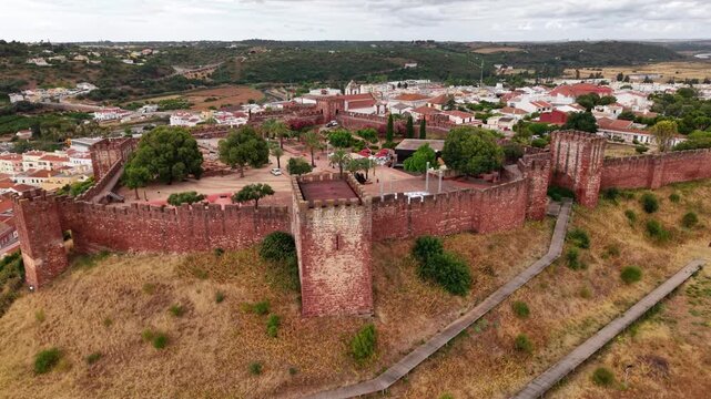 Exploring silves castle a historic landmark in algarve portugal from an aerial perspective on a bright summer day