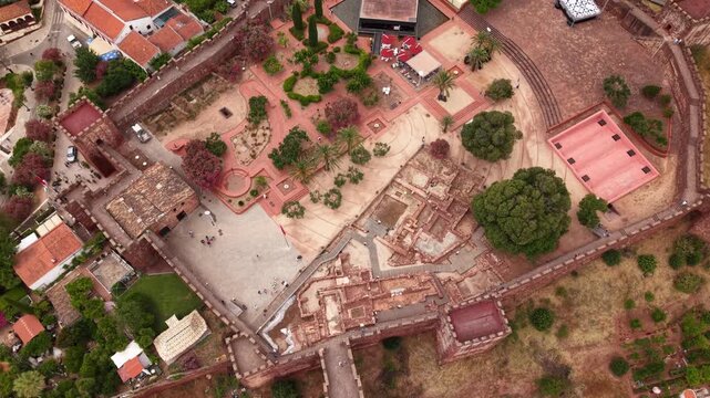 Aerial view of silves castle in algarve portugal on a sunny day with tourists visiting the moorish fortress