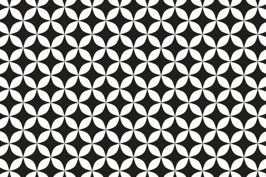This high-contrast geometric pattern features a repeating tessellation of black and white shapes. The design consists of interlocking four-petaled elements that resemble stylized flowers or quatrefoil