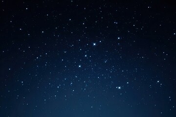 Sparkling stars scattered across a deep blue nighttime sky