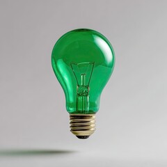 A bright green lightbulb floats against a soft gray background, casting a faint shadow