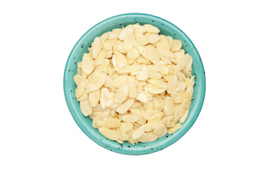 Fresh almond flakes in plate isolated on white background, closeup