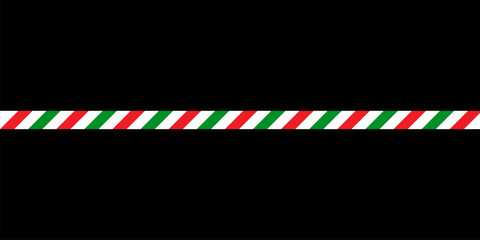 Festive Christmas-themed striped ribbon with red and green diagonal patterns, placed horizontally on a black background for an elegant Christmas decoration or seasonal gift wrapping concept
