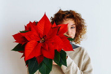 young woman with a flowerpot Christmas star