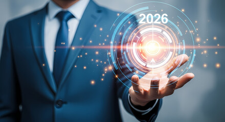 Businessman presenting a futuristic glowing circle with 2026 on it in his hand