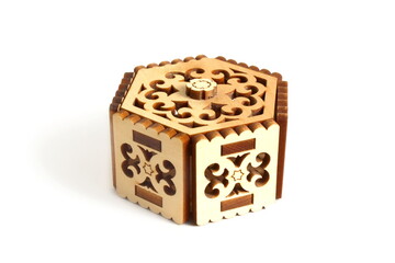 There is a decorative wooden box on a white background.	