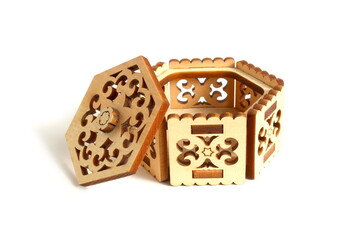 There is a decorative wooden box on a white background.	