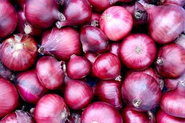Texture of purple onions in one pile.