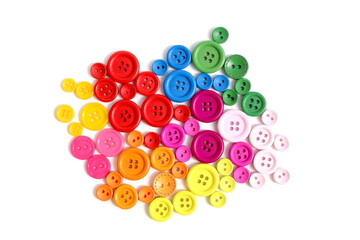 There are many multi-colored buttons on a white background.