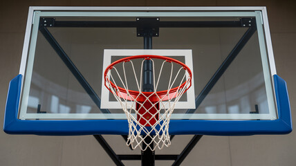 Close up photograph of a basketball hoop and backboard setup capturing outdoor sports equipment athletic training recreation and competitive game atmosphere