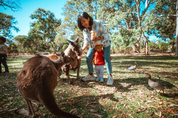 young mother and child enjoy bonding during wildlife educational experience at park
