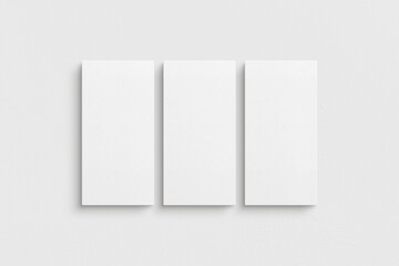 Canvas mockup 1:2. Set of three canvases. Gallery wall mockup, set of 3 canvases. Clean, modern, minimalist, bright. Portrait. Vertical.