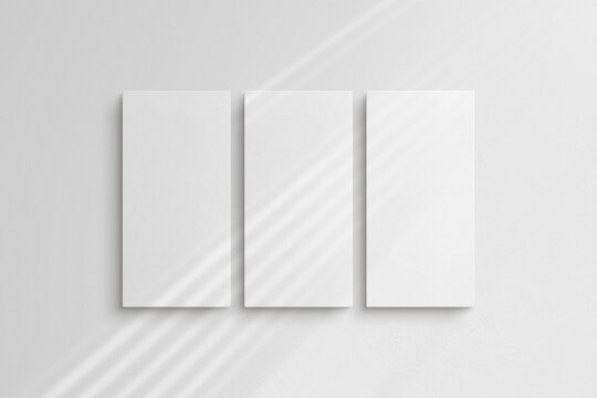 Canvas mockup 1:2. Set of three canvases. Gallery wall mockup, set of 3 canvases. Clean, modern, minimalist, bright. Portrait. Vertical. Shadow overlay.