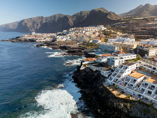 Aerial view of rocky coast Los Gigantes. Panorama the city of Puerto de Santiago and Los Gigantes, Tenerife, Canary Islands, Spain.