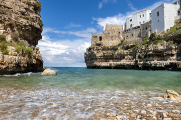 Panoramic view of Polignano a Mare, panorama of the Lama Monachile beach, waterfront and the buildings of the old town, Puglia, Italy