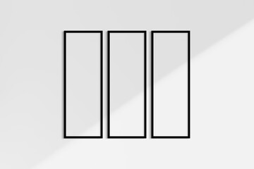 Frame mockup 1:3. Set of three thin black frames. Gallery wall mockup, set of 3 frames. Clean, modern, minimalist, bright. Portrait. Vertical. Shadow overlay.