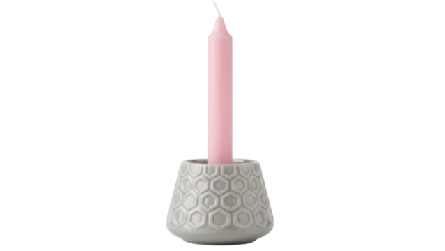 Pink taper candle in gray honeycomb ceramic holder isolated PNG, decorative accent for home decor and special occasions - Powered by Adobe