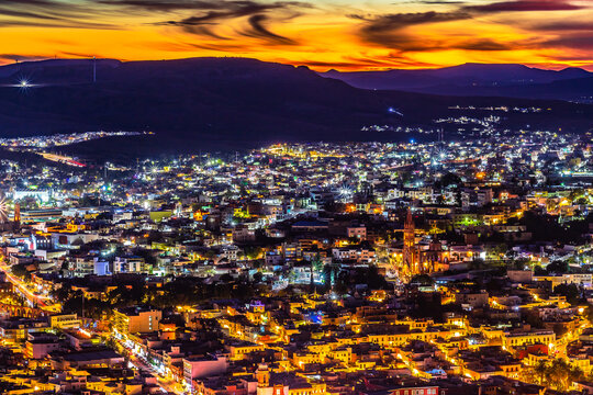 Aerial view of a city during a red sunset, view of the city of Zacatecas from La Bufa